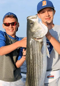 What could be better than taking young anglers like these two fishing for Block Island striped bass.