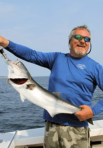 Catching aggressive snapper bluefish inshore or offshore can be an awesome RI experience.