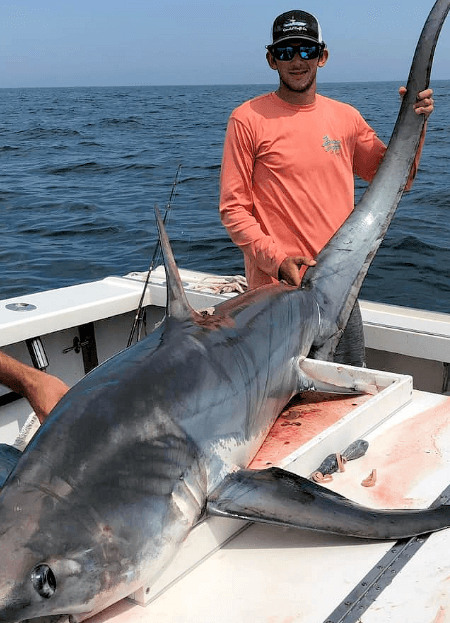Offshore deep sea big game shark posed with Rhode Island angler.